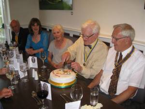 Michael cutting his cake